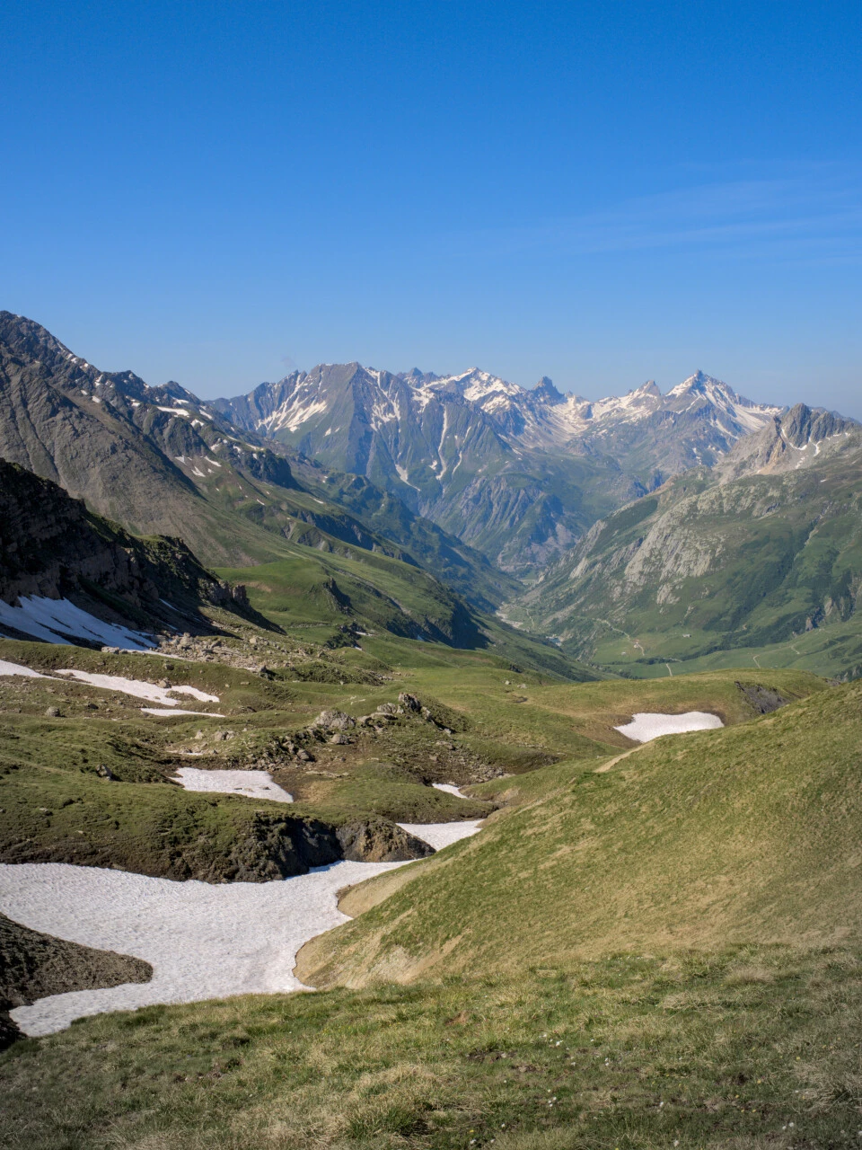 Alpine pastures and snowfields in Val Veni, high-summer feel
