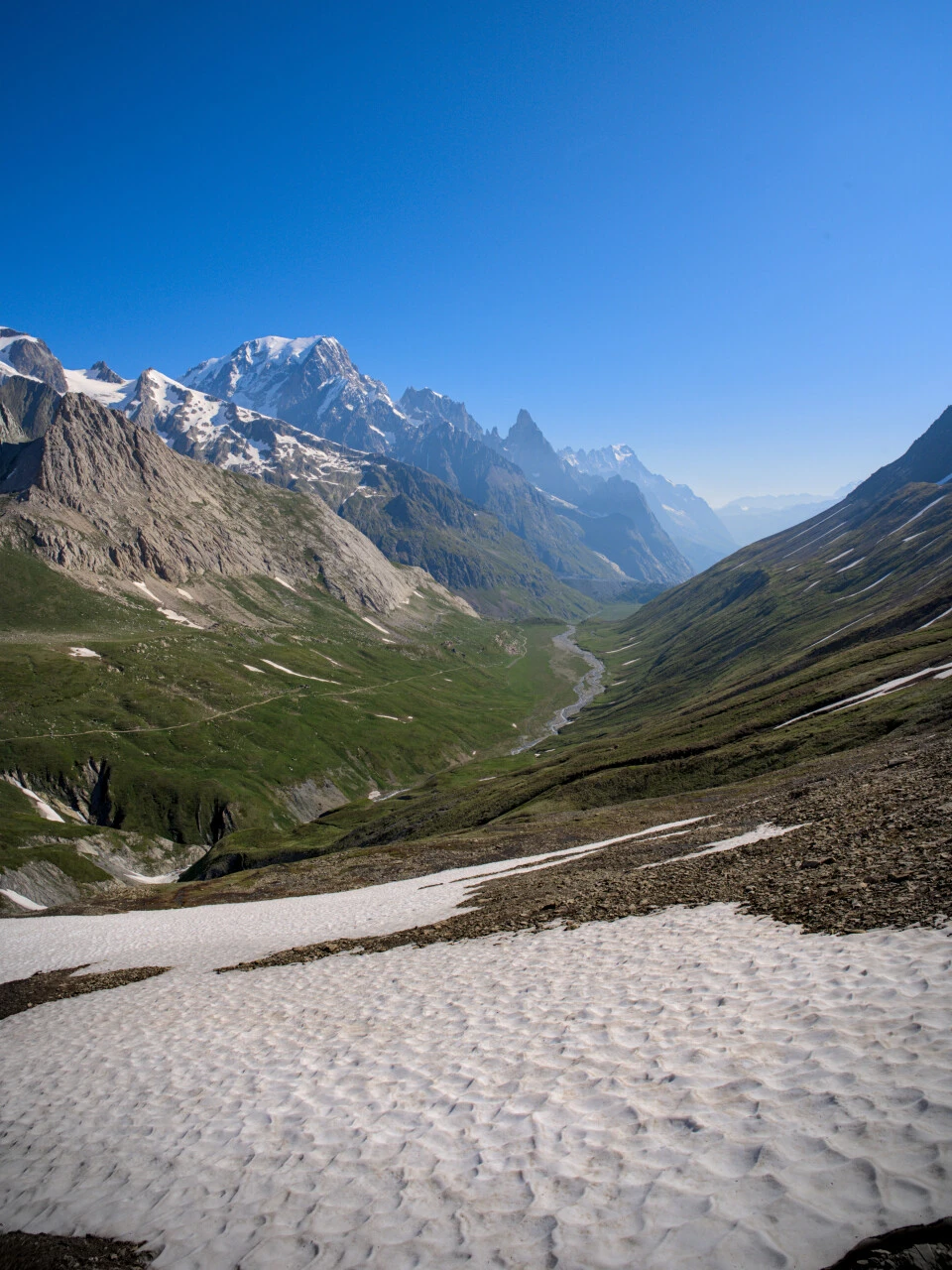 Val Veni in summer, snowfields on the slopes of the Mont Blanc massif